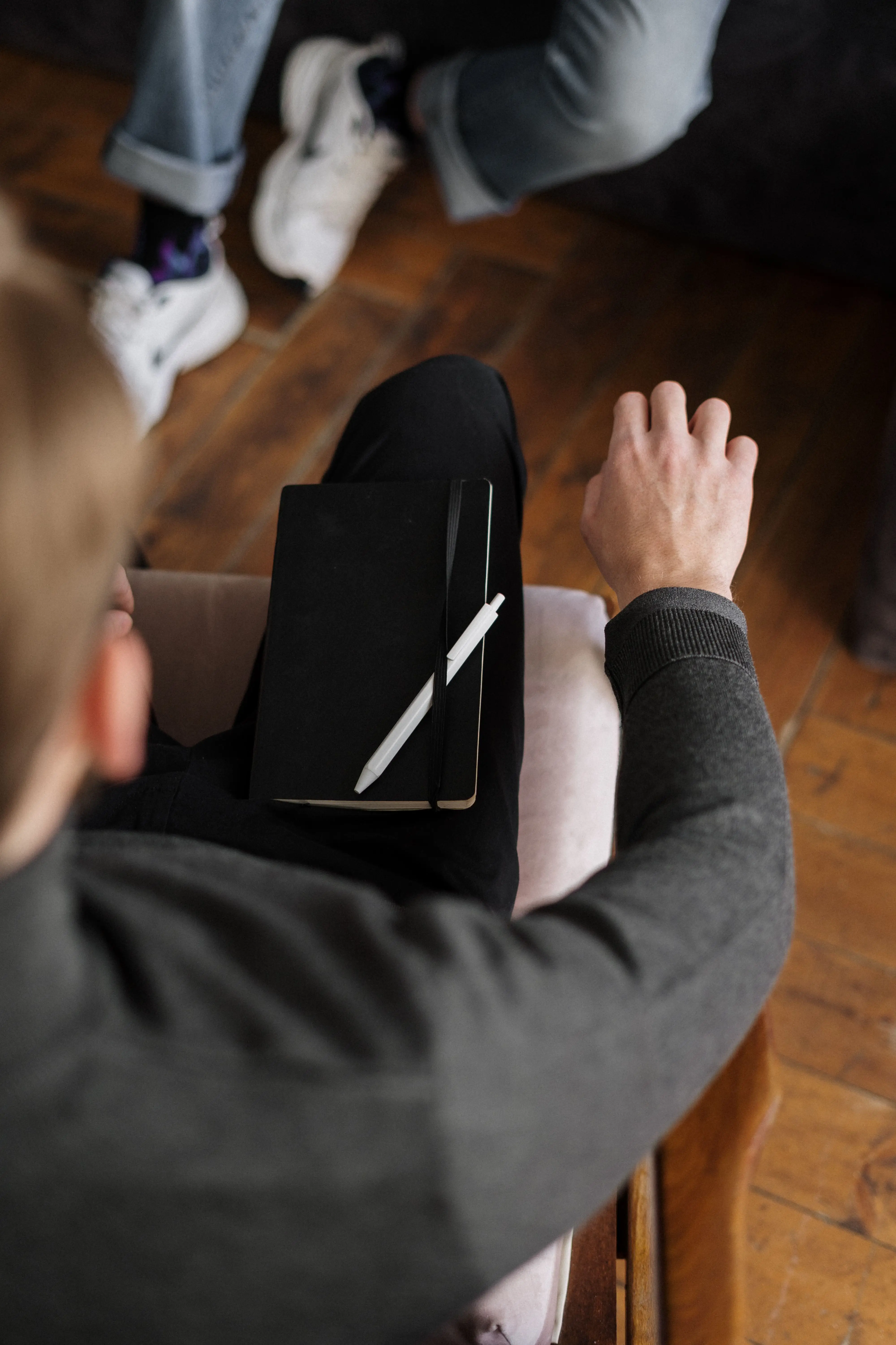 A conversation between coach and client, seen from above